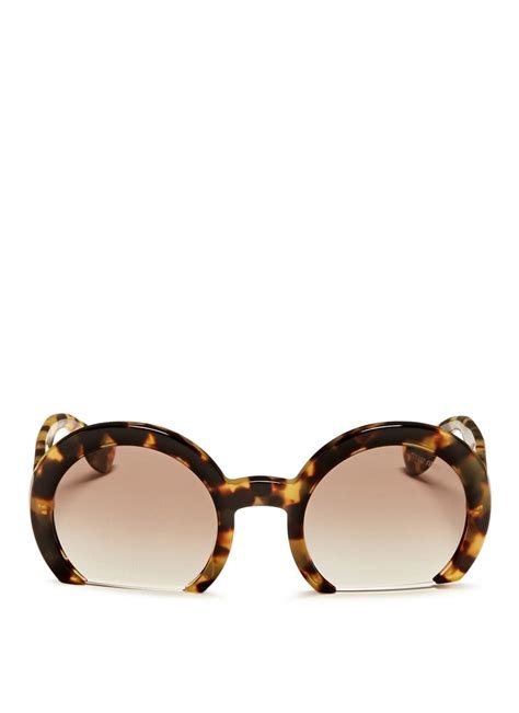 Miu Miu Tortoise Rasoir Sunglasses .